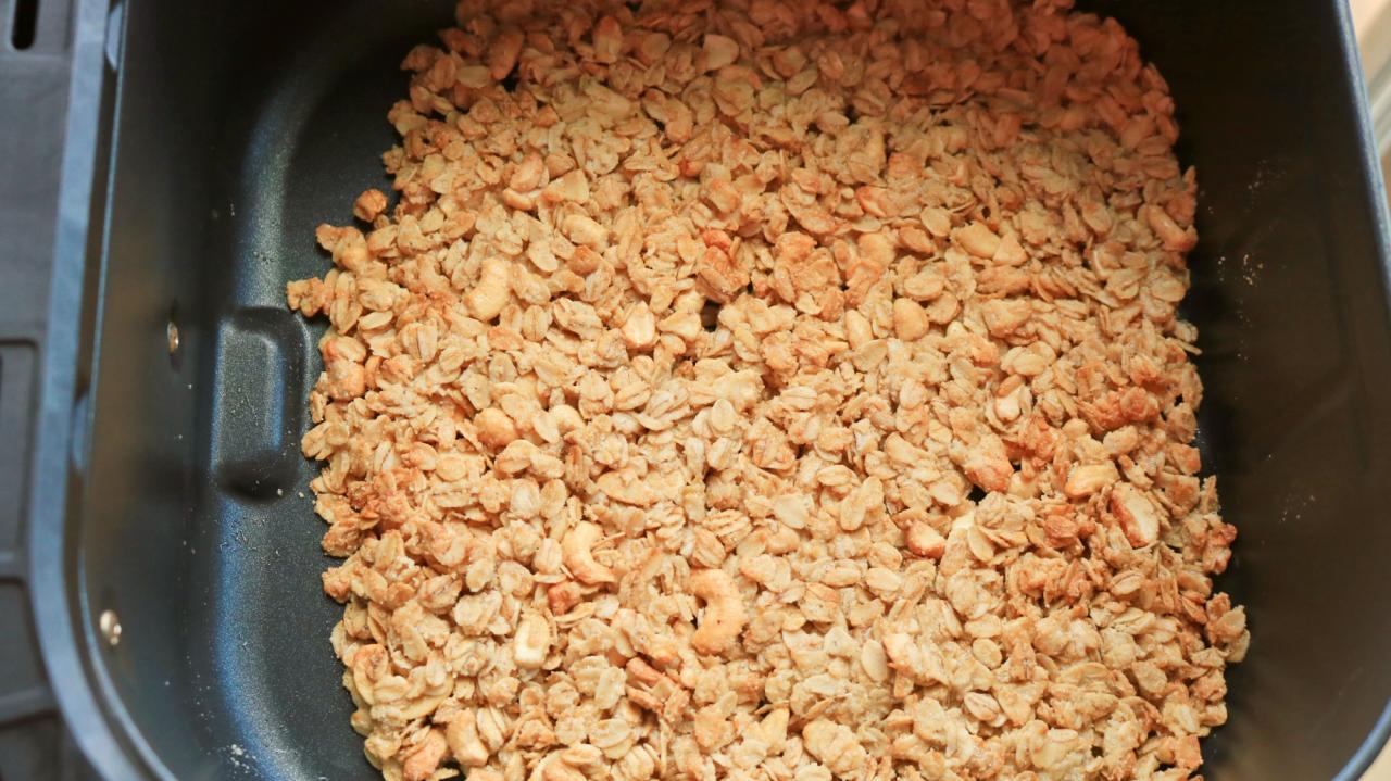 Air fried granola pressed into the air fryer basket.