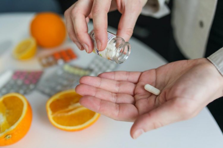 Free Person Taking Pill Stock Photo