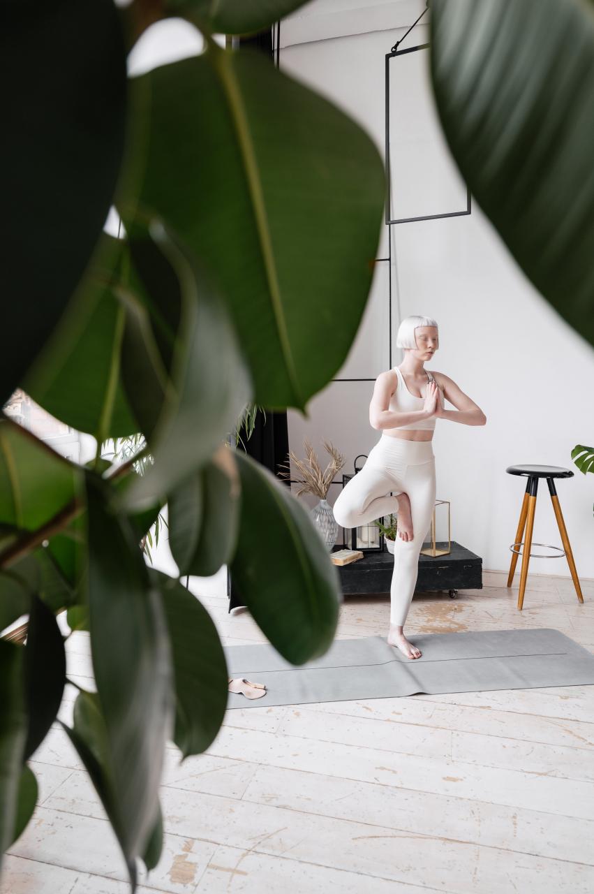 A Woman Doing a Yoga Pose Stock Photo